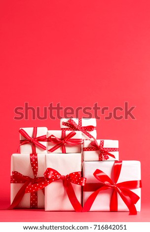 Collection of Christmas present boxes on a red background
