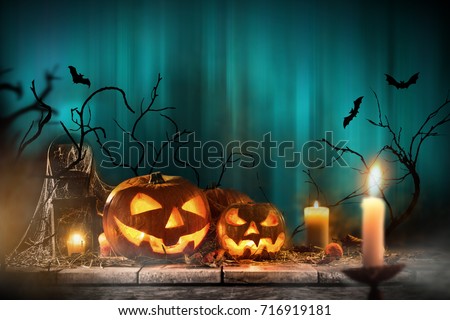 Halloween pumpkins on wooden planks with blue background.