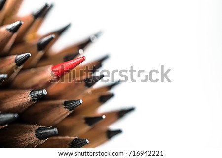 Close up point of pencils and red color pencil stand out of the other, concept to leader, think different, success business, smart idea, good people,