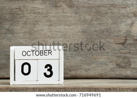 White block calendar present date 3 and month October on wood background (German unity, South Korea National foundation day)