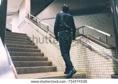 Man going upstairs