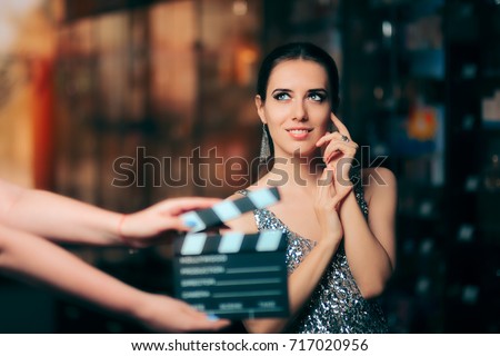 Glamorous Model Starring in Fashion Campaign Video Commercial - Brand ambassador diva endorsing a fashionable brand while shooting in a studio 
 Royalty-Free Stock Photo #717020956