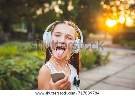 joy girl listening music on the telephone