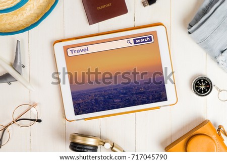Online travel search on Tablet with tokyo background