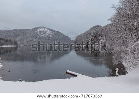 The view of Alpsee lake in winter time with mountain reflection. Germany.