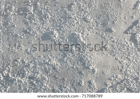 Outdoors White background of  uneven plaster, cement texture