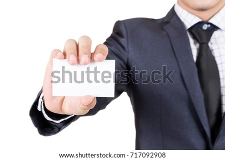 Businessman holding white business card isolated on white background