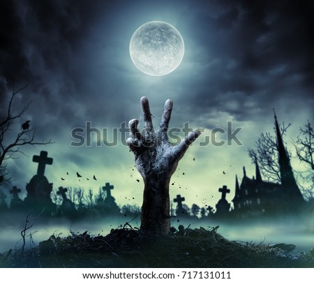 Zombie Hand Rising Out Of A Grave
 Royalty-Free Stock Photo #717131011