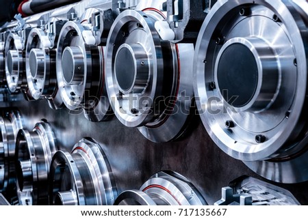 Large, massive steel rollers machines for wire drawing. Abstract industrial background. Royalty-Free Stock Photo #717135667