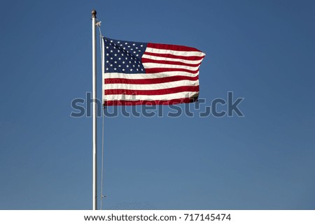View at American flag on the blue sky