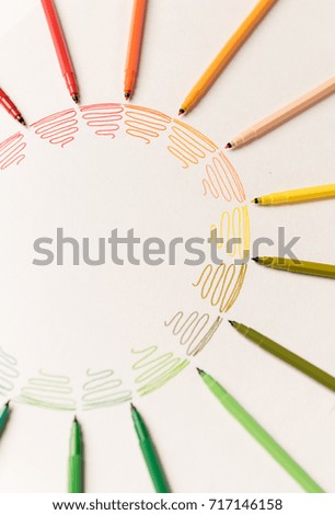 Circle with different colorful stroked painted with markers on white paper. Gradient of colorful strokes. Copy space for logo, advertisement