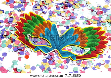 colorful carnival mask and confetti of different colors