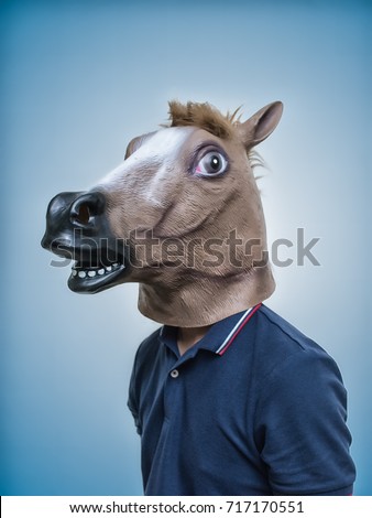 Horse Head Mask Portraiture  Royalty-Free Stock Photo #717170551