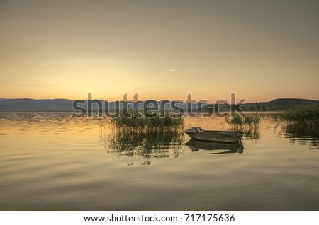 Sunrise scene with boat – Macedonia, Dojran Lake