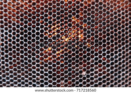 Blurred bee honeycombs background (empty, without bees and honey)