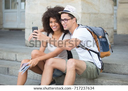young couple on holidays taking selfie