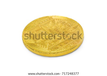 golden bitcoin isolated on white background. shiny gold coin with the bitcoin symbol lying on its side on a white table close-up
