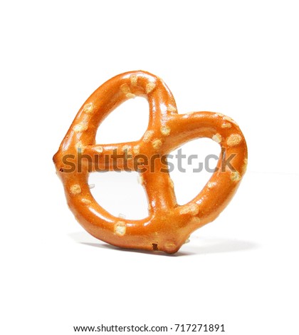 Mini salted pretzel isolated on white background. salted cracker pretzel isolated on white background. salty, snack, appetizer, white Royalty-Free Stock Photo #717271891
