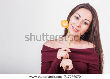 image of cute woman with one flower.