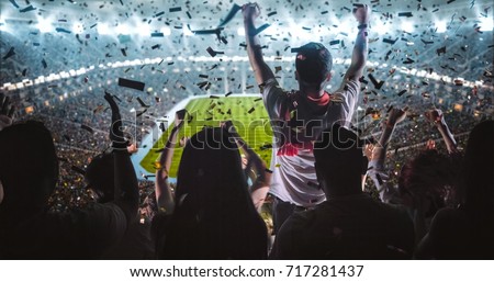 Group of fans are cheering for their team victory Royalty-Free Stock Photo #717281437