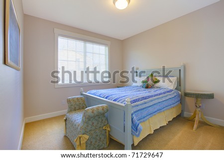Nice clean blue and beige bedroom