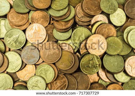 Gold coins in Thai baht background texture.