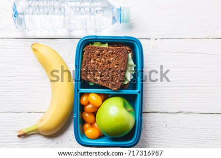 Image of sports light lunch in box, bottle of water