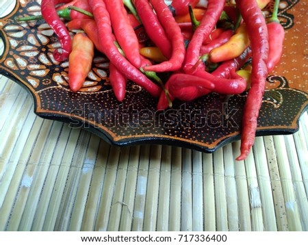 Close Up of Hot Chili at Batik Wooden Bowl
