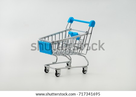 Shopping cart on white background. E-commerce concept