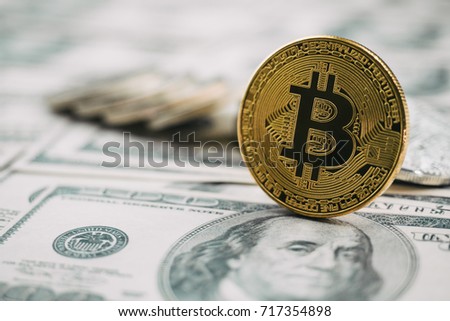 Golden bitcoin on dollar banknote background, modern currency concept