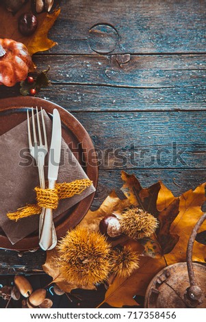 Thanksgiving day dinner. Autumn fruit with plate and cutlery. Thanksgiving autumn background
