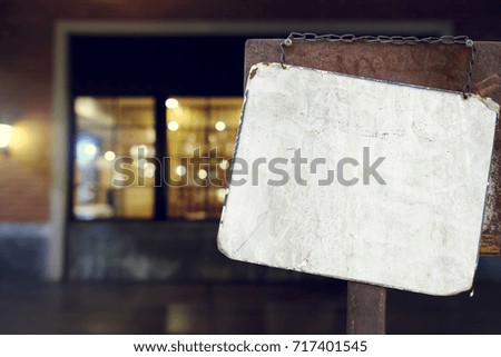 sign hanging outside a restaurant, store, office or other