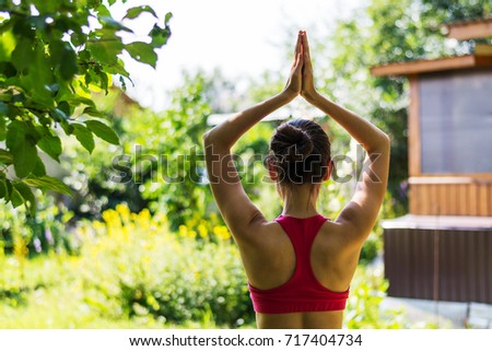 A young Russian woman meditating in the Park.