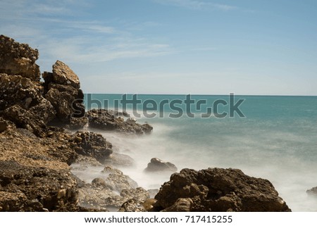 Ocean with rocks and a long shutter time.