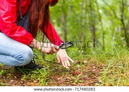 Photo of girl with magnifying glass
