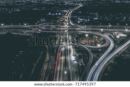 Aerial view of landscape perfect night road, top view at night traffic long exposure. color tone effect.