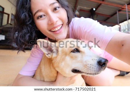 Asian woman selfie with dog