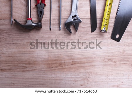 Mechanic tools set or Assorted work tools on wooden background