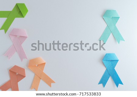 Another set of strips of lymphoma, colon, prostate, uterine, breast and leukemia cancer made of paper with white background.