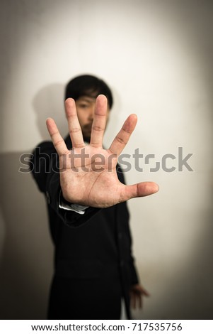 Asian businessman show stop sign,five fingers,stop corruption,Stop corrupt nation,Thailand people wear black suit