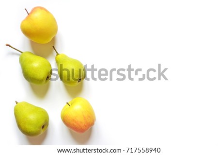 Three green pears and two apples. Summer fruits, natural vitamins. Healthy eating concept. Flat lay stock photo, top view. Food photography.  free space for text