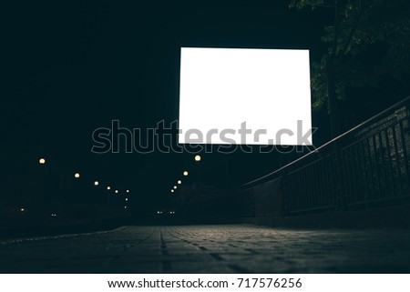 Blank advertising screen in the street at night, low angle shooting