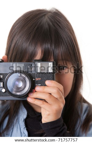 a girl with camera taking photograph.