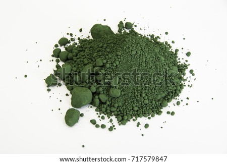 extreme close up of green pigment called Chromium oxide isolated over white background Royalty-Free Stock Photo #717579847