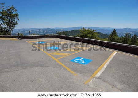 Parking spaces reserved for the disabled in outdoor lot for the public