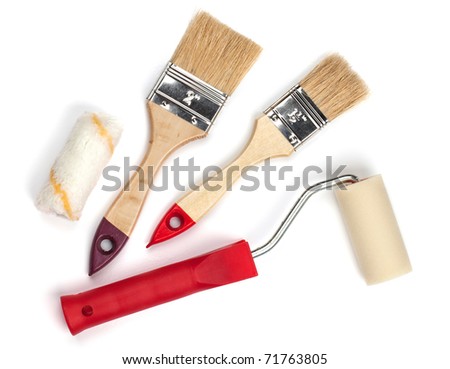 Two wooden paintbrushes and roller. Isolated on white background