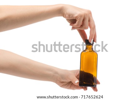 Female hands medicine tincture syrup on white background isolation