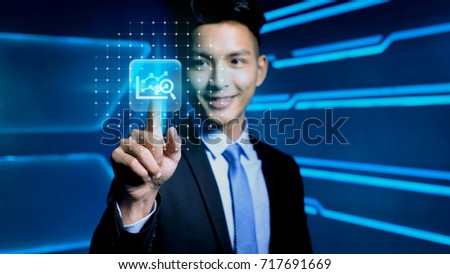 businessman touch big data icon on blue background