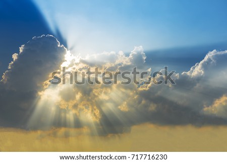 Sunset sky with cloud and sun ray. Nature background. Miracle, hope, or amazing nature concept. Royalty-Free Stock Photo #717716230