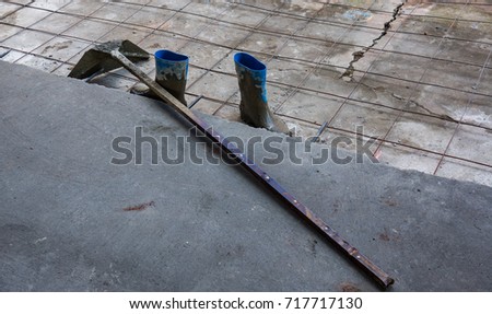 Cement protection boot and Steel shovel Cement and  Steel mesh flooring on ground 